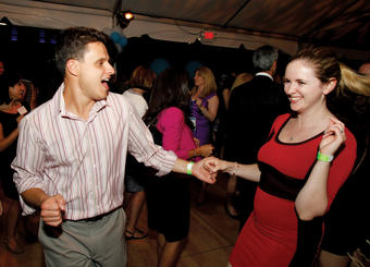 Two attendees get into the swing of things at the Starlight Reception. Photo: Eileen Barroso